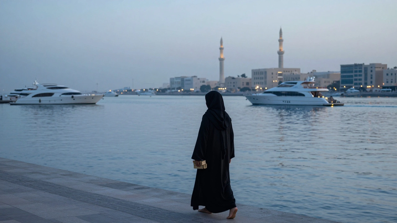 A woman walking alone along Dubai Creek at dawn, holding books as the city wakes in soft blue light.